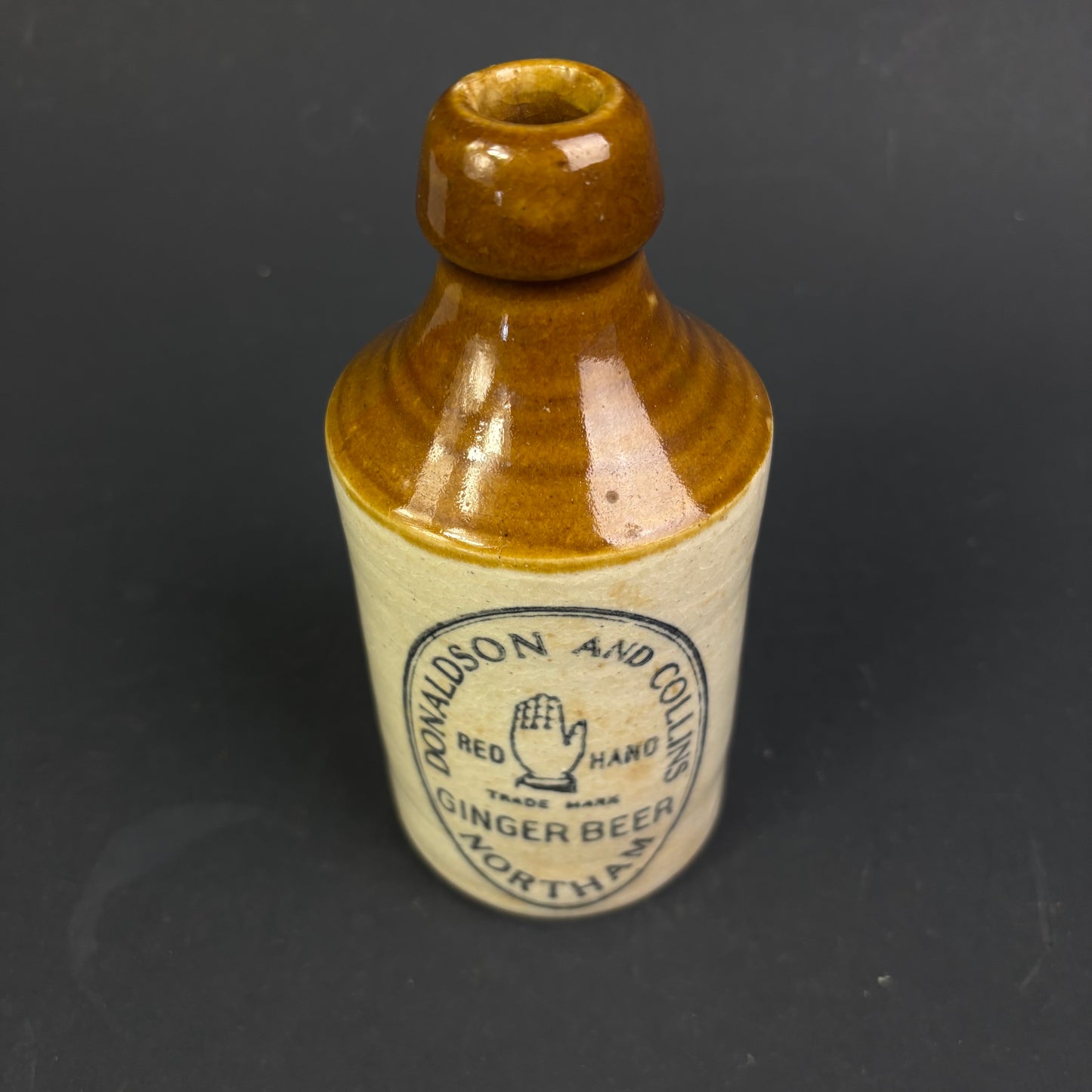 Donaldson & Collins "Red Hand" Ginger Beer Bottle – Northam WA Stoneware Advertising Bottle c.1900–1920