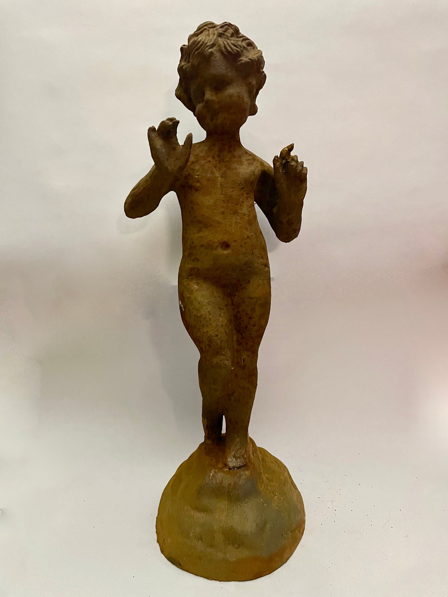 Cast iron boy statue