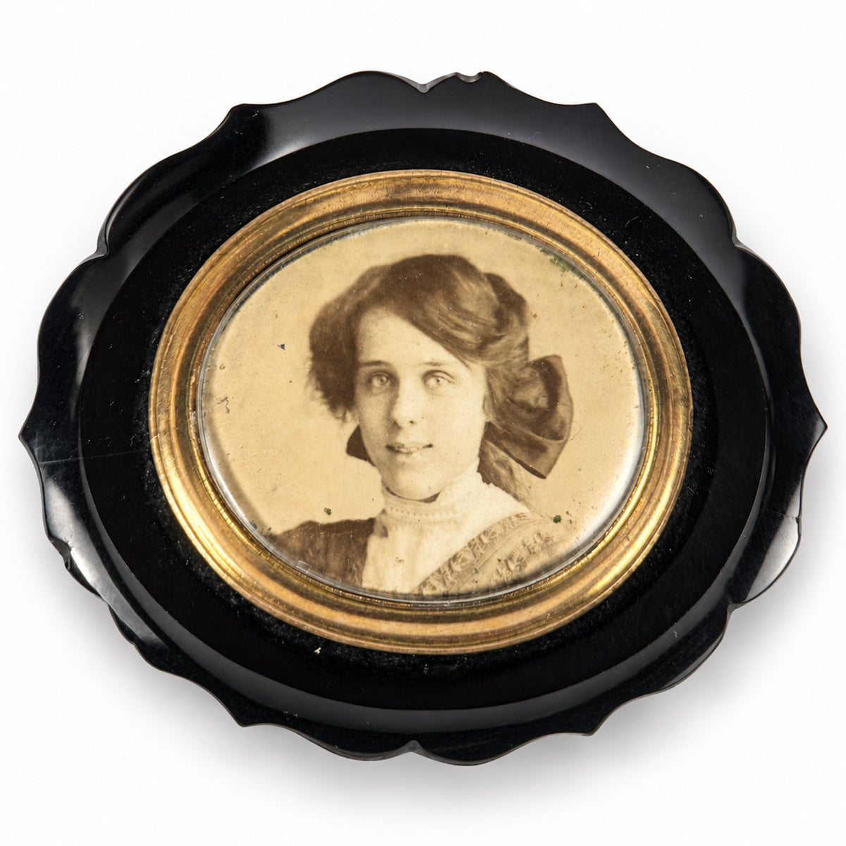 Late Victorian black mourning brooch with photographic portrait and gold coloured mount