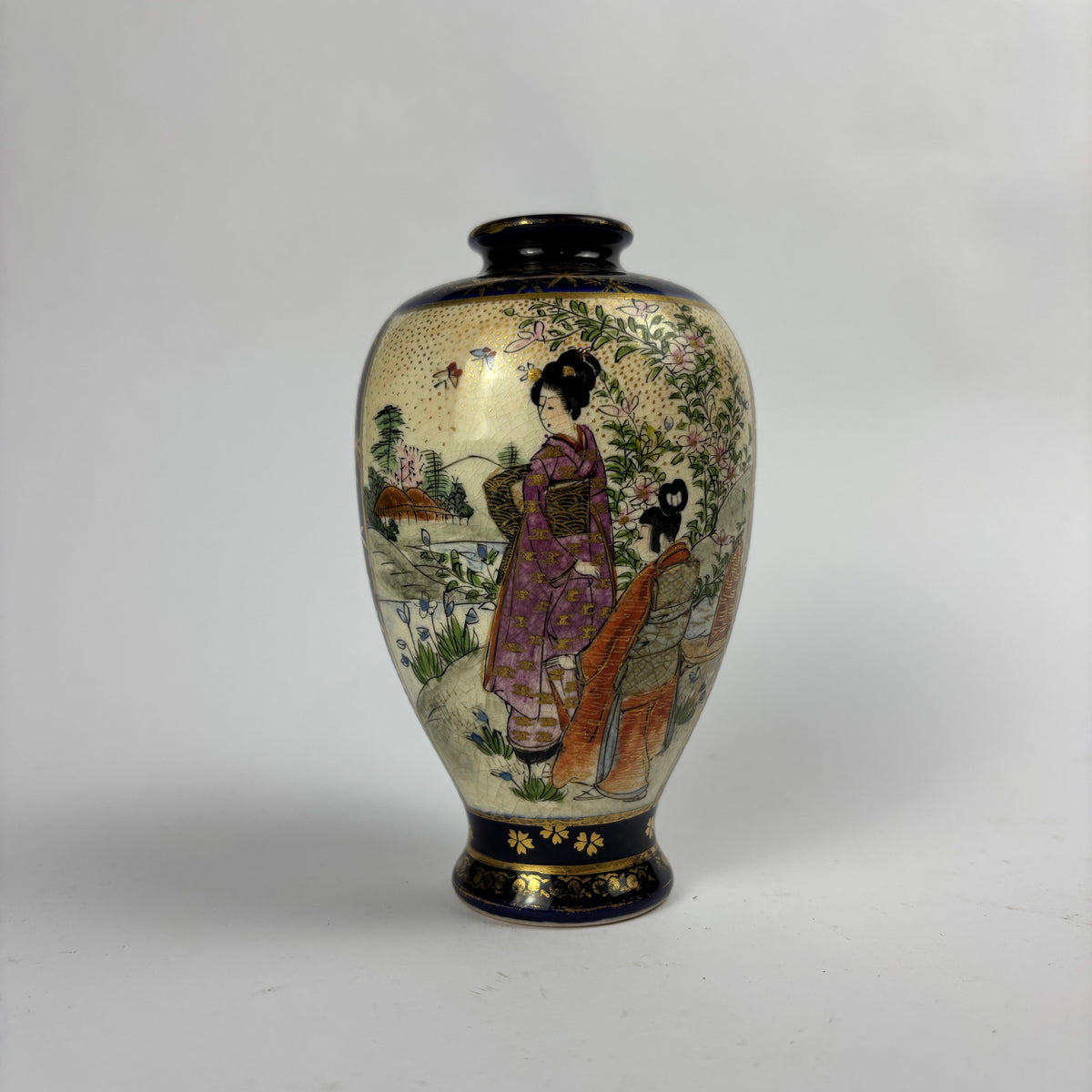 Small cobalt blue and gilt Satsuma-style vase with figures, flowers and crackle glaze