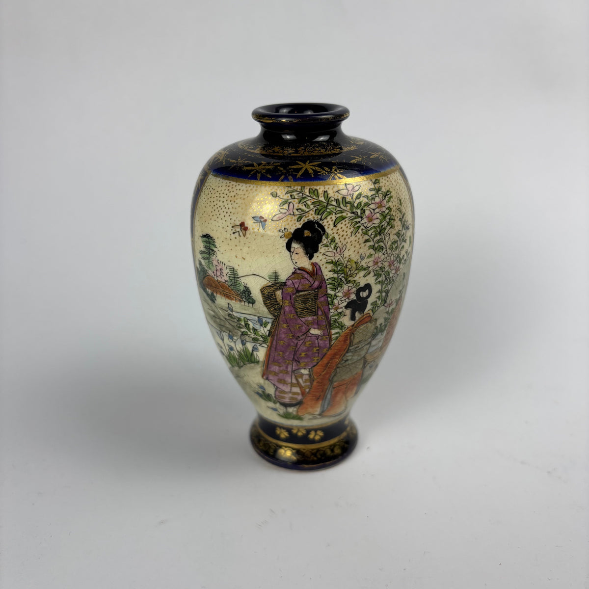 Small cobalt blue and gilt Satsuma-style vase with figures, flowers and crackle glaze