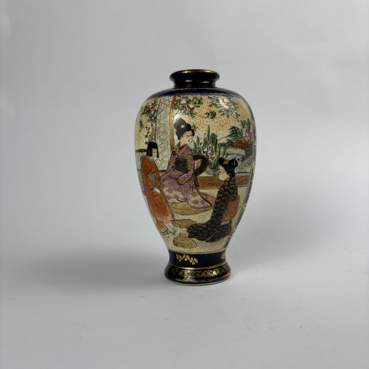 Small cobalt blue and gilt Satsuma-style vase with figures, flowers and crackle glaze