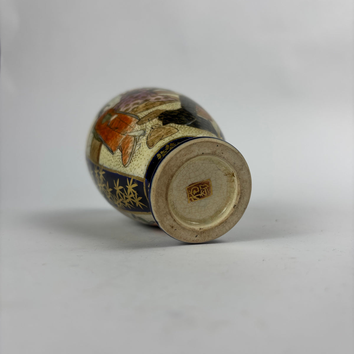 Small cobalt blue and gilt Satsuma-style vase with figures, flowers and crackle glaze