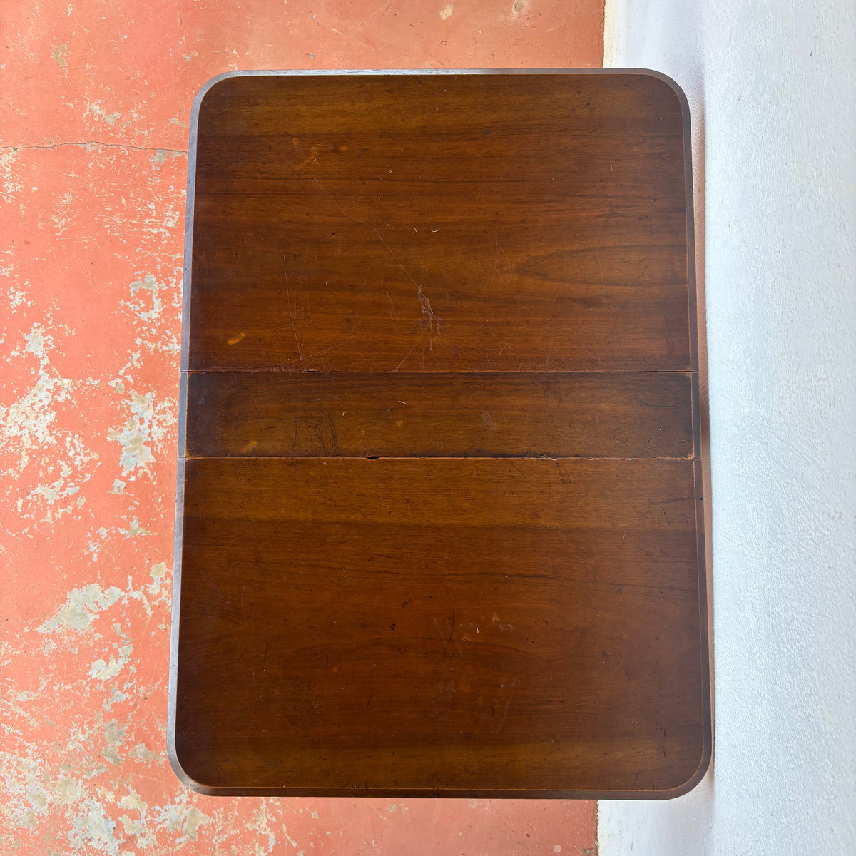 Antique timber drop-leaf table shown extended